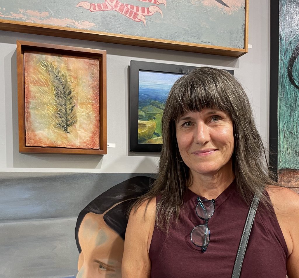 Mary Beth standing next to her submission for the State Fair Rejects show.